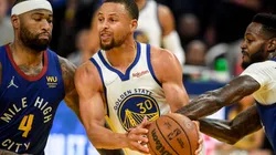 DeMarcus Cousins of the Denver Nuggets and Stephen Curry of the Golden State Warriors