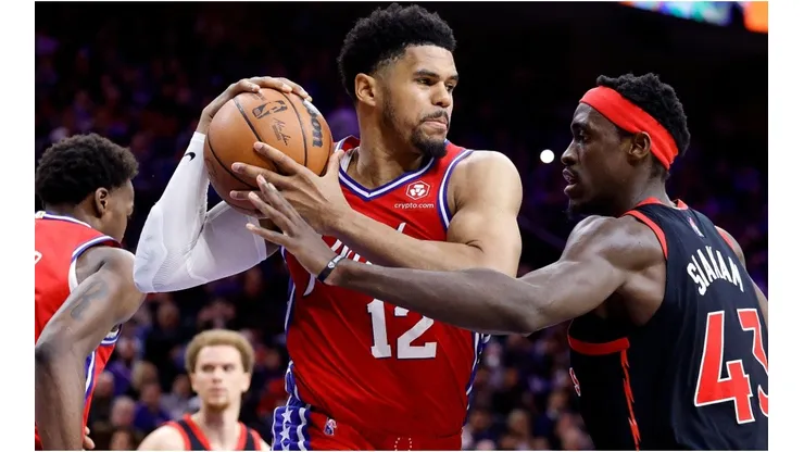 Tobias Harris of the Philadelphia 76ers is guarded by Pascal Siakam of the Toronto Raptors