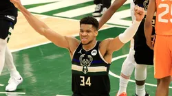 Giannis Antetokounmpo #34 of the Milwaukee Bucks celebrates in the final second before defeating the Phoenix Suns in Game Six