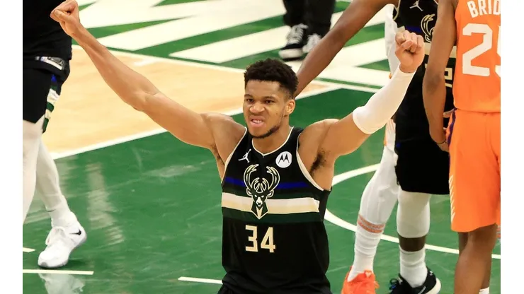 Giannis Antetokounmpo #34 of the Milwaukee Bucks celebrates in the final second before defeating the Phoenix Suns in Game Six