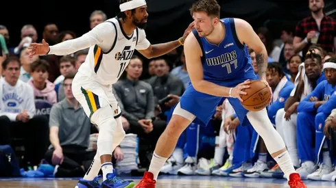 Luka Doncic of the Dallas Mavericks is guarded by Mike Conley of the Utah Jazz