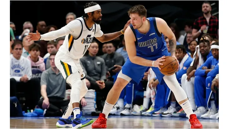 Luka Doncic of the Dallas Mavericks is guarded by Mike Conley of the Utah Jazz