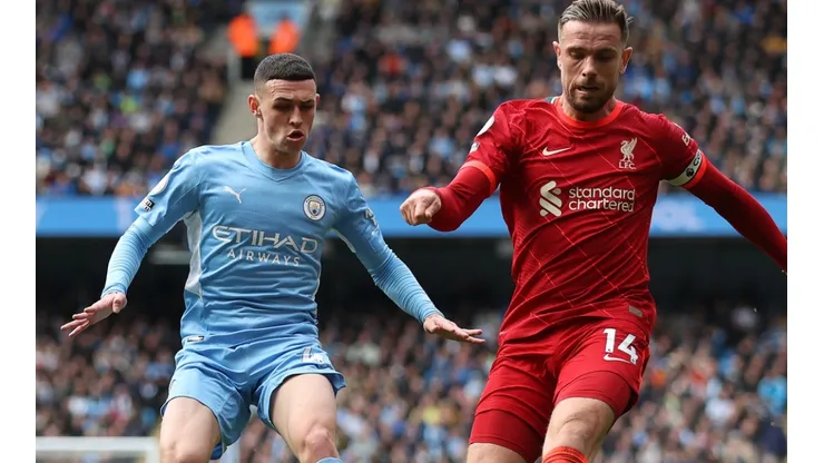 Phil Foden of Manchester City and Jordan Henderson of Liverpool