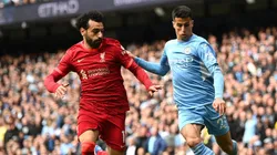 Joao Cancelo of Manchester City is challenged by Mohamed Salah of Liverpool