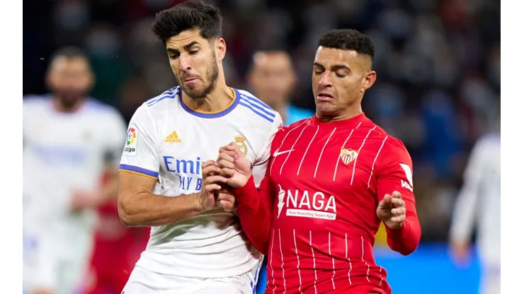 Marco Asensio of Real Madrid and Diego Carlos of Sevilla