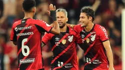 Marlos of Athletico Paranaense celebrates with teammates Matheus Fernandes and Marcinho after scoring