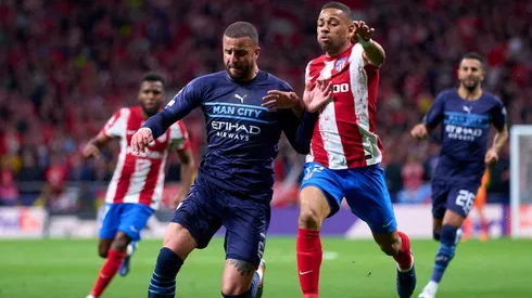 Renan Lodi of Atletico Madrid competes for the ball with Kyle Walker of Manchester City