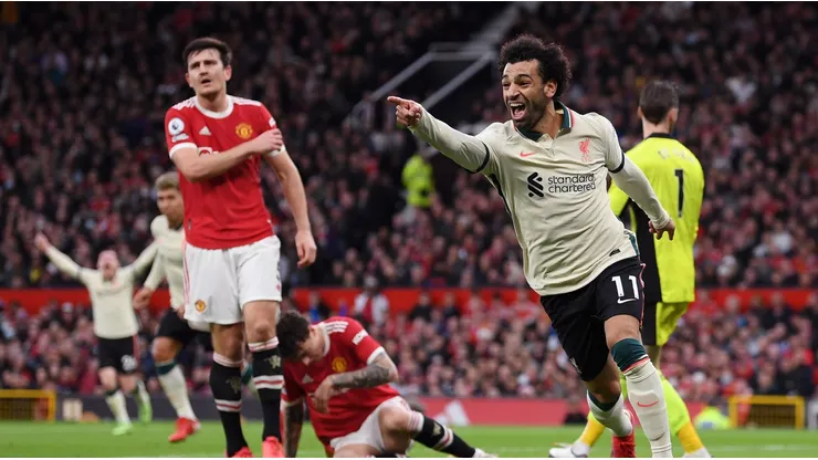 Mohamed Salah of Liverpool celebrates after scoring their side's third goal during the Premier League match between Manchester United and Liverpool