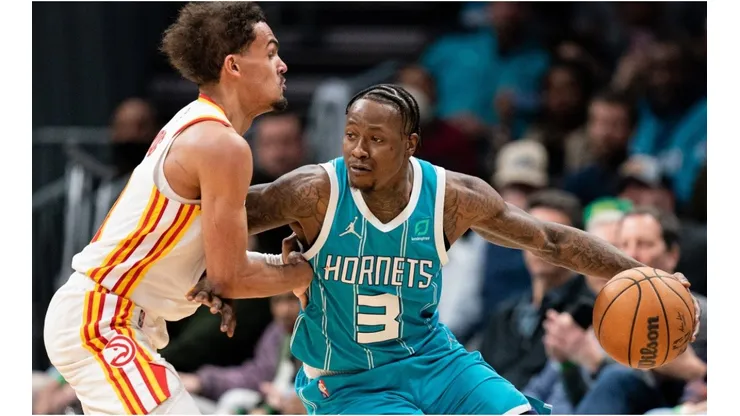 Trae Young of the Atlanta Hawks guards Terry Rozier of the Charlotte Hornets