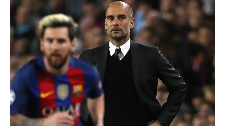 Pep Guardiola watches Lionel Messi in action from the sidelines.