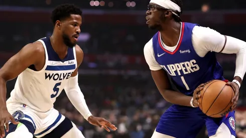 Reggie Jackson of the Los Angeles Clippers handles the ball against Malik Beasleyof the Minnesota Timberwolves