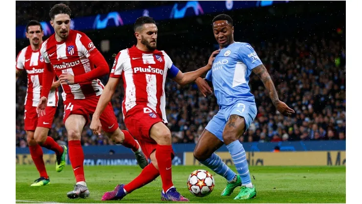 Raheem Sterling of Manchester City is tackled by Koke of Atletico Madrid