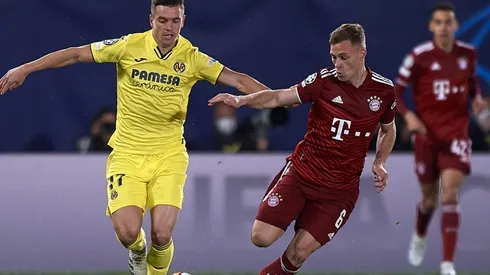 Giovani Lo Celso of Villarreal in action against Joshua Kimmich of Bayern Munich during Champions League match
