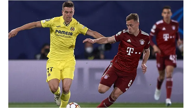 Giovani Lo Celso of Villarreal in action against Joshua Kimmich of Bayern Munich during Champions League match