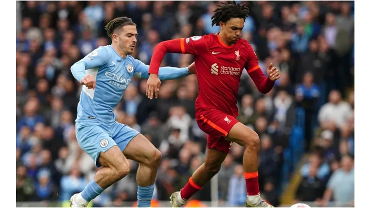 Manchester City's Jack Grealish (left) and Liverpool's Trent Alexander-Arnold battle for the ball