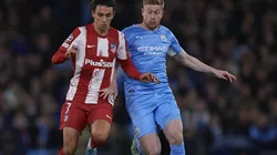 Kevin De Bruyne of Manchester City competes for the ball with Joao Felix of Atletico de Madrid
