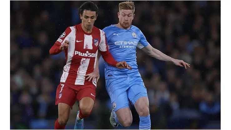 Kevin De Bruyne of Manchester City competes for the ball with Joao Felix of Atletico de Madrid