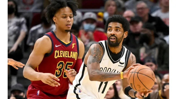 Isaac Okoro of the Cleveland Cavaliers and Kyrie Irving of the Brooklyn Nets