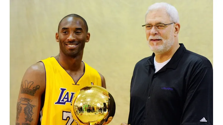 Kobe Bryant and Phil Jackson pose with NBA Finals Larry O'Brien Championship Trophy.