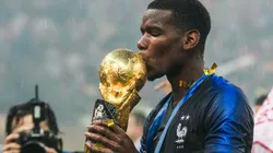 Paul Pogba kisses the FIFA World Cup Trophy he won with France in Russia 2018