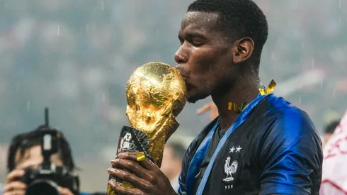 Paul Pogba kisses the FIFA World Cup Trophy he won with France in Russia 2018