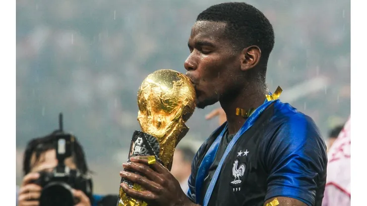 Paul Pogba kisses the FIFA World Cup Trophy he won with France in Russia 2018