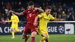 Munich's Lucas Hernandez (l) and Villarreal's Giovani Lo Celso fight for the ball.