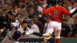 Xander Bogaerts #2 of the Boston Red Sox scores a run past Kyle Higashioka #66 of the New York Yankees