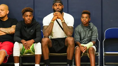 Bronny James (left), LeBron James (middle), and Bryce Maximus James