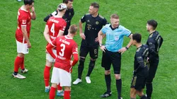 Freiburg and Bayern players during a break in play