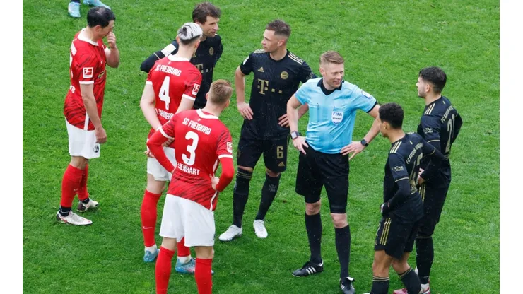 Freiburg and Bayern players during a break in play