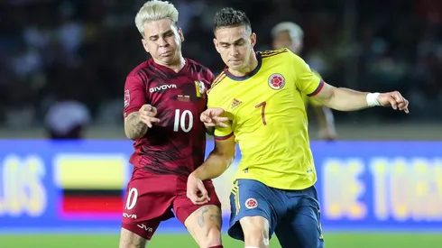 Yeferson Soteldo of Venezuela fights for the ball with Rafael Borré of Colombia
