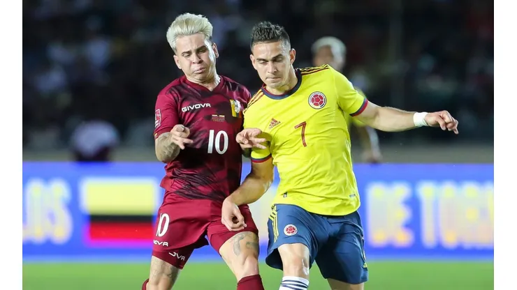 Yeferson Soteldo of Venezuela fights for the ball with Rafael Borré of Colombia