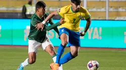 Lucas Paqueta of Brazil fights for the ball with Jose Sagredo of Bolivia.