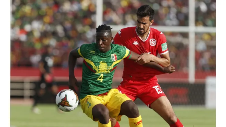 Mohamed Ali Ben Romdhane (R) of Tunisia in action against Amadou Haidara (L) of Mali