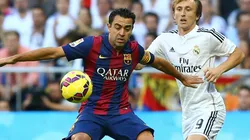 Xavi of Barcelona and Luka Modric of Real Madrid
