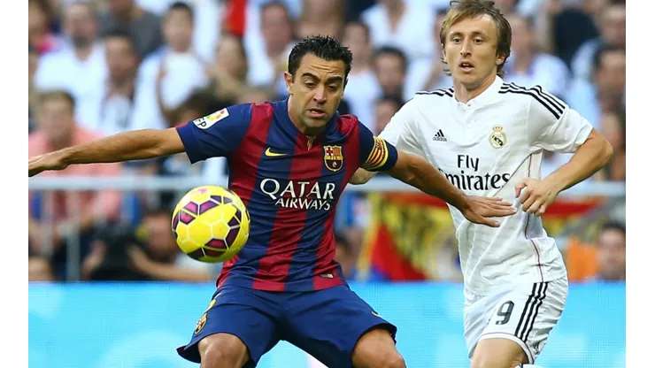 Xavi of Barcelona and Luka Modric of Real Madrid