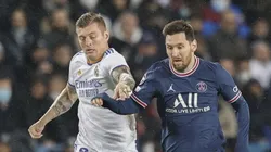 Toni Kroos of Real Madrid (left) fights for ball control against Messi of PSG