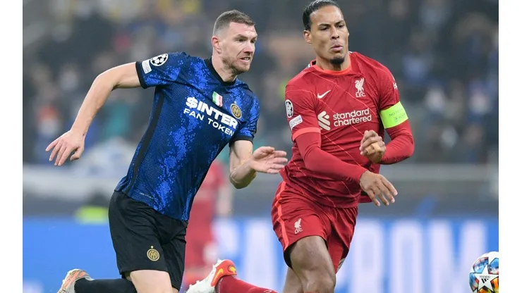 Edin Dzeko of FC Internazionale and Virgil van Dijk of Liverpool FC.