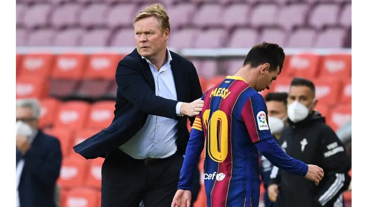 Ronald Koeman and Lionel Messi of Barcelona
