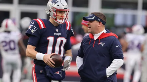 Former New England Patriots offensive coordinator Josh McDaniels (right) and Mac Jones.