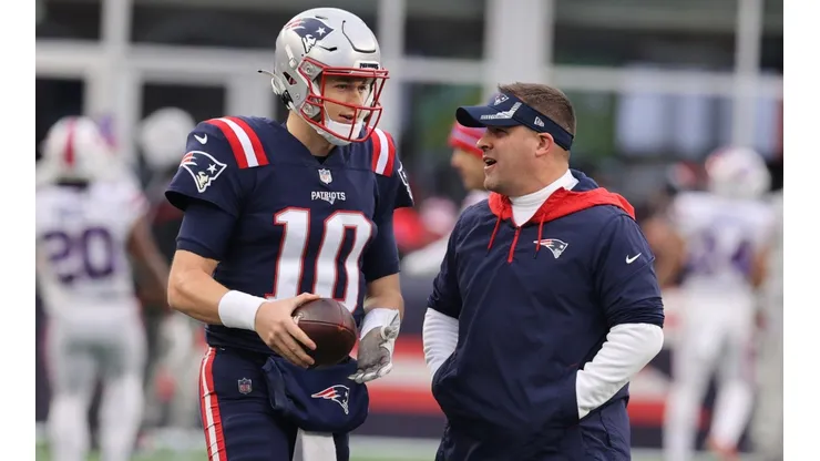 Former New England Patriots offensive coordinator Josh McDaniels (right) and Mac Jones.