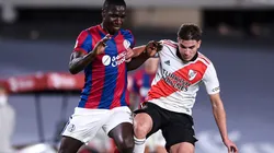 Cristian Zapata of San Lorenzo (left) protects the ball against Julian Alvarez of River Plate.
