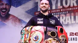 Josh Taylor stands with his titles