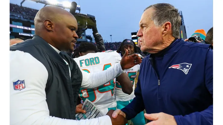 Brian Flores (left) and Bill Belichick.