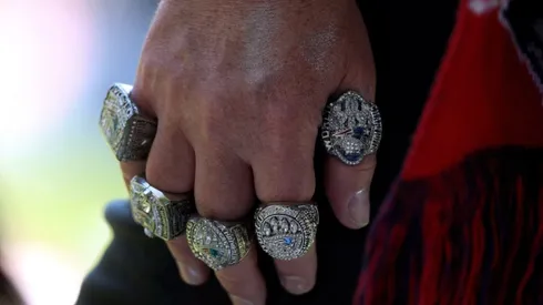 Fan with his hand full of Patriots Rings