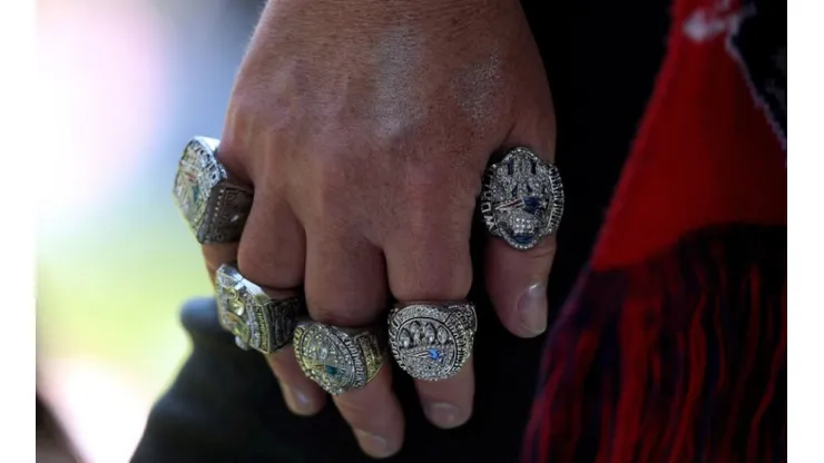 Fan with his hand full of Patriots Rings