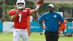Brian Flores (right) and Tua Tagovailoa.