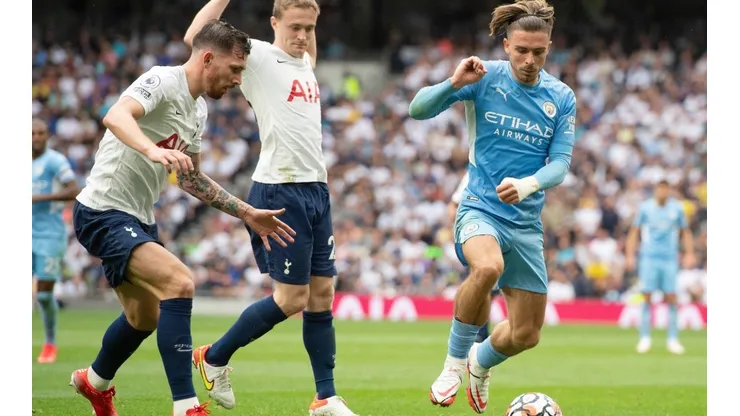 Pierre-Emile Højbjerg of Tottenham Hotspur closes down Jack Grealish of Manchester City