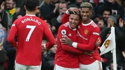 Manchester United players celebrate after scoring a goal